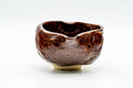 Wabi-sabi katakuchi water cooler, front view, glossy dark burgundy glaze with a pinched pouring lip