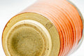 Close-up of the spiralling ribbed texture and foot of the cup.