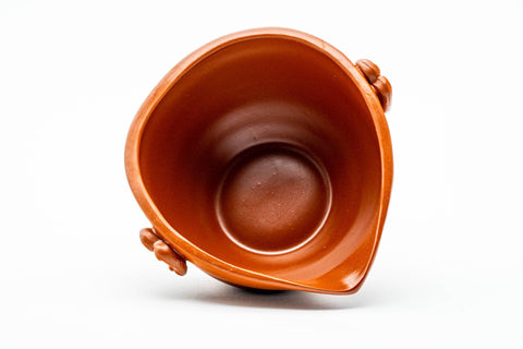 Angled view into the bowl, revealing the smooth red interior.