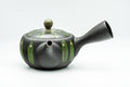 Alternate three-quarter view of the green-striped black teapot.