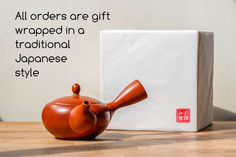 Tezumi — gift-wrapping information card shown with a red teapot, noting orders are wrapped in a traditional Japanese style