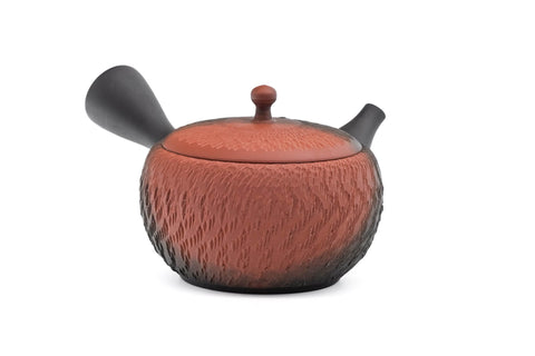 Black-and-red yōhen Tokoname kyusu teapot with side handle and dimpled tochiri texture - front view with the handle to the right