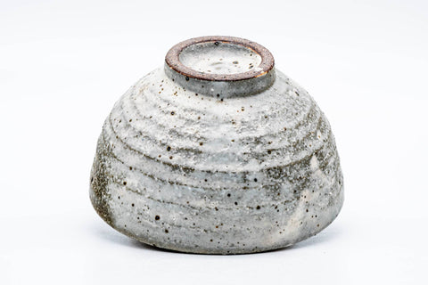 The bowl tipped to reveal its ridged foot and base.