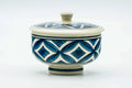 The lidded teacup from another angle, lid on.