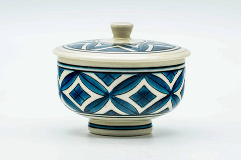 The lidded teacup from another angle, lid on.