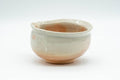 Japanese Tea Set - Hagi-yaki Katakuchi Water Cooler with 5 Guinomi Tea cups - three-quarter view of the katakuchi showing the spotted gohonte glaze