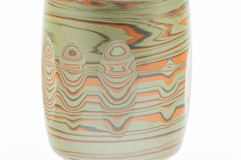 Tezumi — Japanese Teacup - 雲仙窯 Unzen Kiln - Carved Nerikomi Tokoname-yaki Yunomi - 170ml — tipped to show the interior