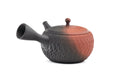 Black-and-red yōhen Tokoname kyusu teapot with side handle and dimpled tochiri texture - side view with the spout to the left