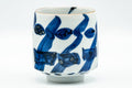 Tezumi — Japanese Teacup - Large Blue Geometric Patterned Arita-yaki Yunomi - 180ml — tipped to show the interior
