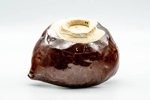 Tilted view of the katakuchi showing the pale unglazed foot and underside