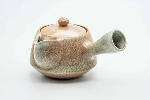 Beige-pink weathered Hagi-yaki kyusu, three-quarter view from the rear with the side handle to the right