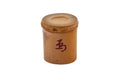 Japanese bamboo futaoki lid rest, upright front view — a cut bamboo node section with a red brushed character on the front and a hollow top opening.