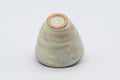 Gohonte Rokurome Mino-yaki yunomi teacup, speckled beige glaze with throwing rings - tilted to show the unglazed clay foot
