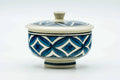 The lidded teacup, lid on, front view.