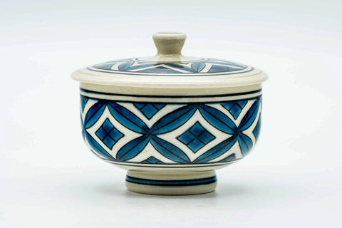 The lidded teacup, lid on, front view.