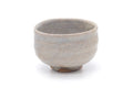 Milky white Hagi chawan, front view with its soft pale glaze.