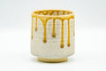 Japanese Teacup - Beige Yellow Drip-Glazed Yunomi - front view of the cup with yellow drip glaze
