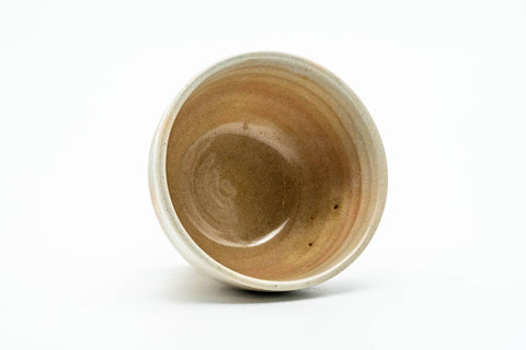 Tilted view looking into the cup, showing the glaze and fine crazing inside.