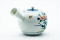 Japanese Kyusu - Blue Floral Porcelain Arita-yaki Ceramic Filter Teapot - 275ml - three-quarter view from the spout side showing the floral decoration