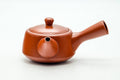 Japanese Kyusu - Smooth Red Shudei Tokoname-yaki Ceramic Filter Teapot - 300ml - three-quarter view of the smooth red body, lid on and handle to the right