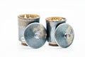 Japanese Teacups - Pair of Matte Drip-Glazed Meoto Yunomi - the larger and smaller cup, one tipped on its side showing the beige-glazed interior, with a slate and beige drip glaze