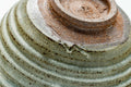 Underside of the bowl, showing the foot ring and spiraled lower body.