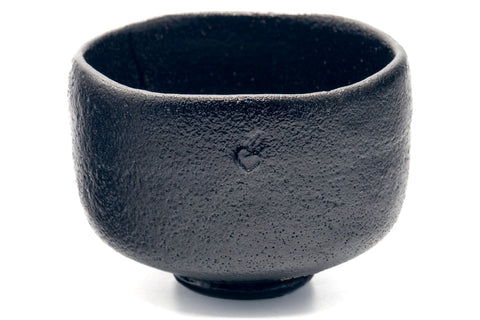Front view showing incised maker's marks on the body.