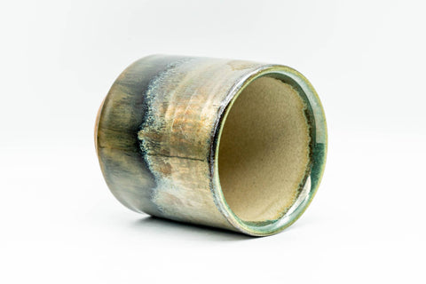 Three-quarter view from above looking into the cup's glazed interior.