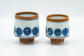Tezumi — Japanese Teacups - Pair of Blue Orange Geometric Arita-yaki Meoto Yunomi — front view from another angle