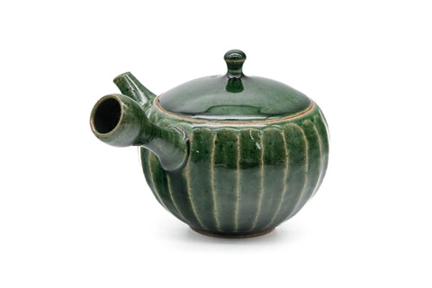 Green faceted Oribe Tokoname teapot, side view showing the spout