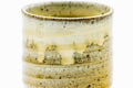 Close-up of the spiraling beige drip glaze on the body.