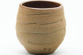 Tezumi — Japanese Teacup - Carved Spiraling Stoneware Yunomi - 120ml — tipped to show the interior