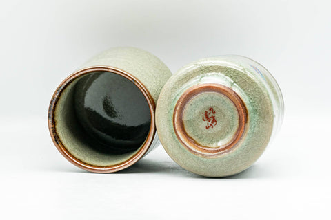 Japanese Teacups - Pair of Geometric Green Celadon Glazed Yunomi - 180ml - both cups tilted showing bases and interiors