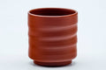 Tezumi — Japanese Teacup - Spiraling Red Shudei Tokoname-yaki Yunomi - 100ml — tipped to show the interior