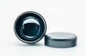 Weathered black-lacquer matcha tea caddy, overhead view with lid off, looking into the dark interior cavity with the lid resting beside