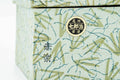 Closeup of the patterned storage box with a bamboo design and label