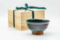 Turquoise gradient matcha bowl shown beside its wooden presentation box (kiribako).