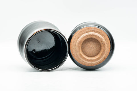 Japanese Teacups - Pair of Jet Black Glazed Yunomi - 130ml - single cup tilted showing the black glaze and tan footring