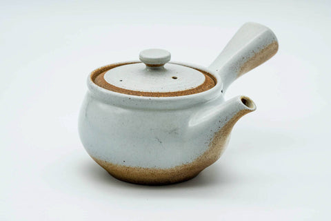 Three-quarter view of the white-glazed kyusu with the lid on.