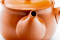 Close-up of the spout and glossy red body.