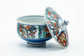 Blue and gold floral Arita-yaki lidded yunomi shown with the lid set beside it.
