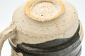 Tezumi — Japanese Teacup - Abstract Brown White Glazed Ushirode Yunomi - 200ml — inverted showing the foot ring