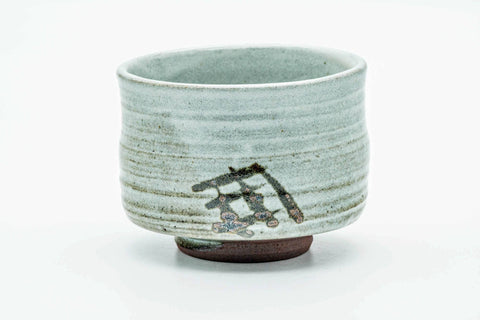 Front view rotated, showing more of the spiralling glaze and grass motif.