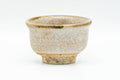 Japanese Teacup - Small Beige Glazed Guinomi - 40ml - side view of the small beige-glazed cup