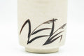 Japanese Teacups - Pair of Beige Long Grass Yunomi - 110ml - close-up of one cup's grass brushwork design