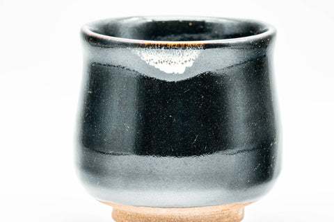Japanese Teacups - Pair of Jet Black Glazed Yunomi - 130ml - overhead view of both cups, one tilted to show the tan base