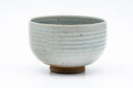 Japanese Matcha Bowl - Grey Mottled Karatsu-yaki Hantsutsu-gata Chawan - 475ml - front view showing the grey mottled Karatsu-yaki glaze with an exposed clay foot