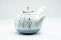 Arita-yaki kyusu teapot, front view, white porcelain with side handle decorated in blue chrysanthemum flowers and vertical stripes