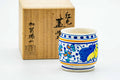 Hand-painted Oranda Banko-yaki futaoki lid rest displayed beside its calligraphy-marked wooden box.