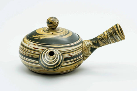 Front view of the marbled teapot with the spout to the left.